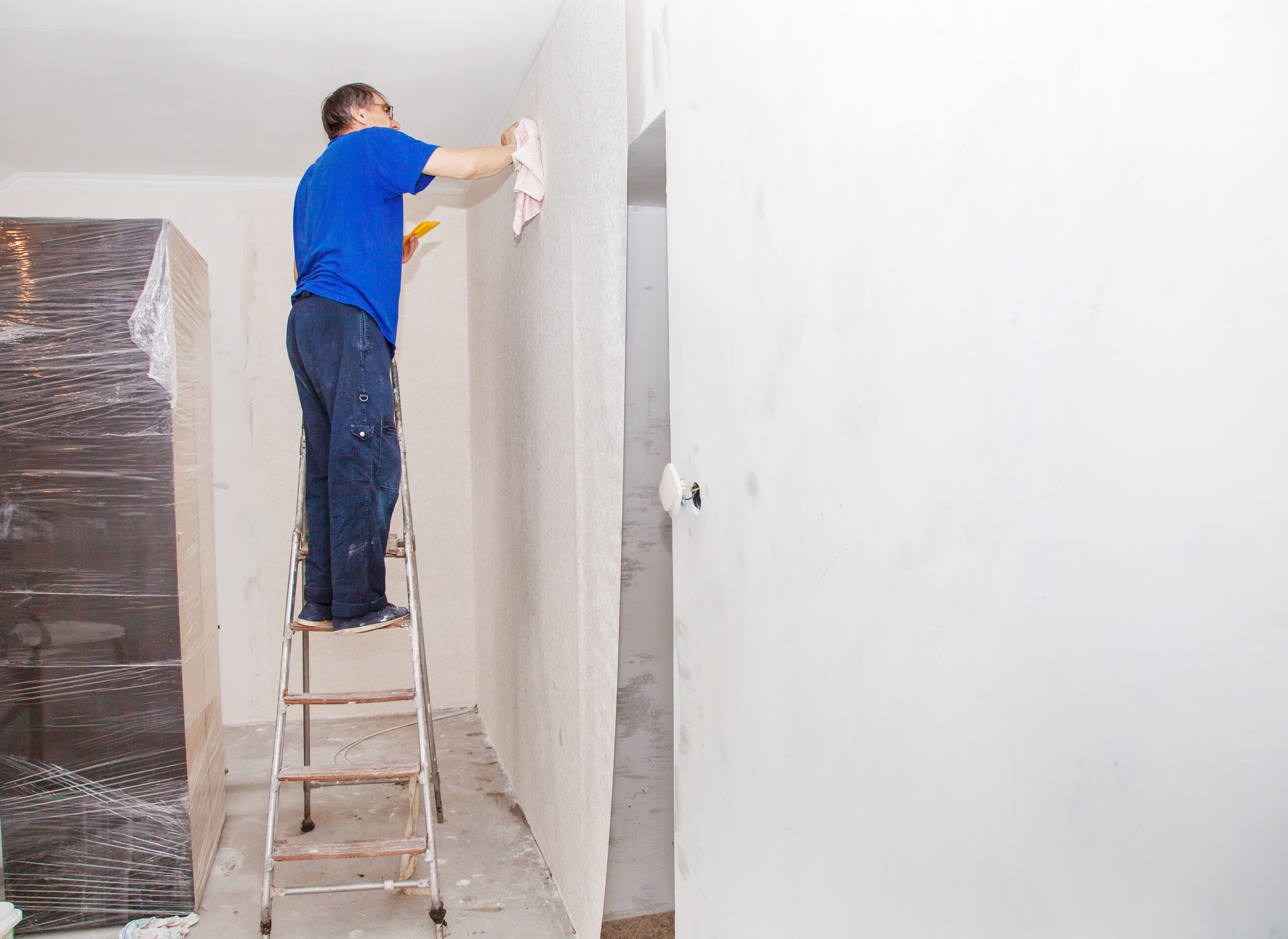 Professional drywall contractor in BC repairing and finishing interior walls for a smooth and durable surface.